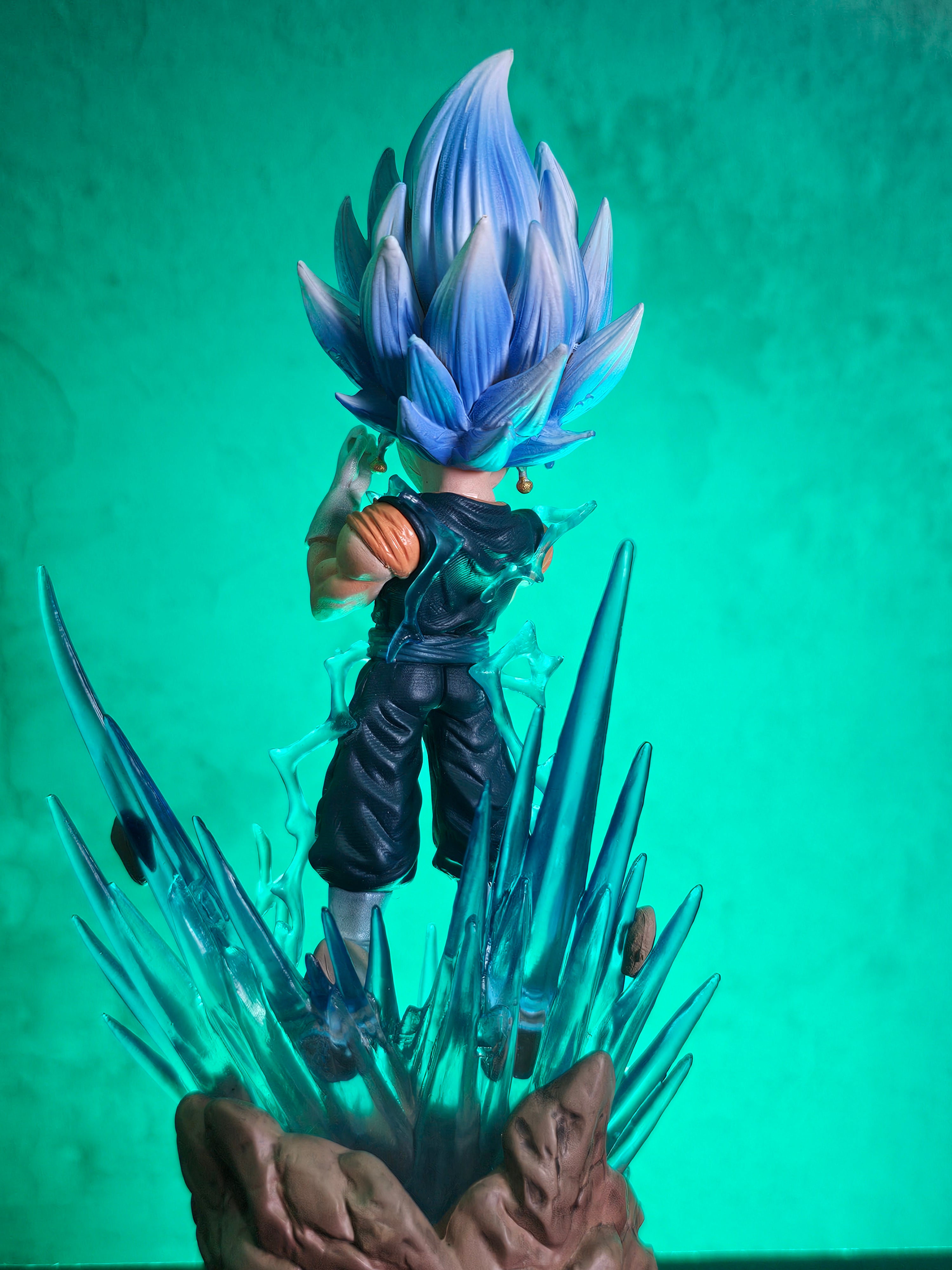 S.h. figuarts full power super saiyan goku standing on a light blue  background, and he is bald, while posing in a charging up pose on Craiyon
